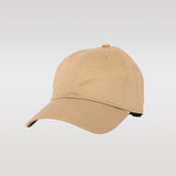 Casquette de baseball beige unie sans logo ni motif.